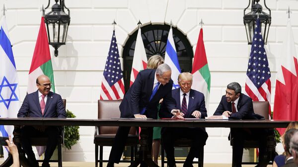 President Donald Trump, center, with from left, Bahrain Foreign Minister Khalid bin Ahmed Al Khalifa, Israeli Prime Minister Benjamin Netanyahu, Trump, and United Arab Emirates Foreign Minister Abdullah bin Zayed al-Nahyan, during the Abraham Accords signing ceremony on the South Lawn of the White House, Tuesday, Sept. 15, 2020, in Washington. (AP Photo/Alex Brandon) - Sputnik International