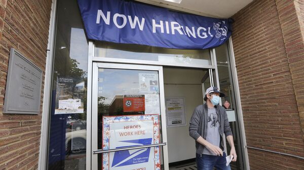 In this Thursday, June 4, 2020 file photo, a customer walks out of a U.S. Post Office branch and under a banner advertising a job opening, in Seattle. The job market took a big step toward healing in May 2020, though plenty of damage remains, as a record level of hiring followed record layoffs in March and April. The Labor Department reported Tuesday, July 7, 2020 that the number of available jobs rose sharply as well, but remained far below pre-pandemic levels.  - Sputnik International