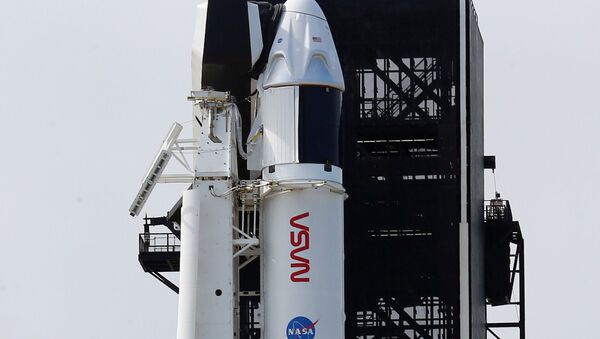 A SpaceX Falcon 9 rocket, topped with the Crew Dragon capsule, is readied to carry four astronauts on the first operational NASA commercial crew mission at Kennedy Space Center in Cape Canaveral, Florida, U.S., November 13, 2020 - Sputnik International