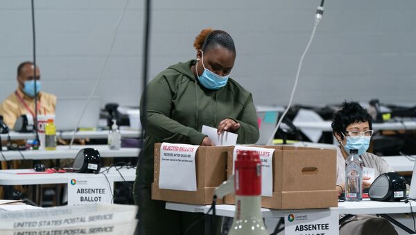Election personnel sort ballots in preparation for an audit at the Gwinnett County Board of Voter Registrations and Elections offices on 7 November 2020 in Lawrenceville, Georgia. Several counties in Georgia continued to count ballots even as news outlets have declared Joe Biden the winner of the race for President.  - Sputnik International
