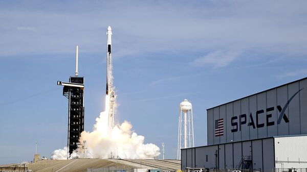 A SpaceX Falcon 9 rocket on a resupply mission to the International Space Station lifts off from pad 39A at the Kennedy Space Center in Cape Canaveral, Fla., Sunday, Dec. 6, 2020. - Sputnik International