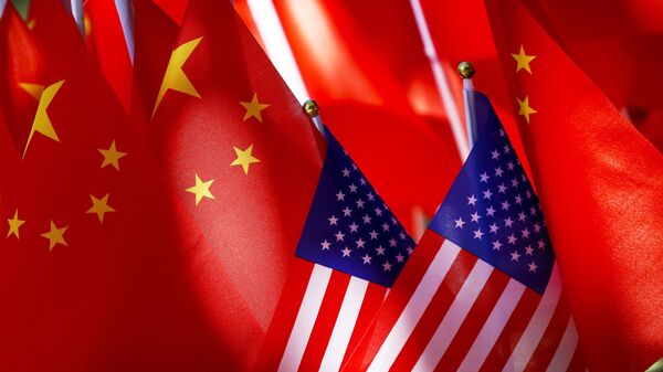  In this Sept. 16, 2018, file photo, American flags are displayed together with Chinese flags on top of a trishaw in Beijing. - Sputnik International