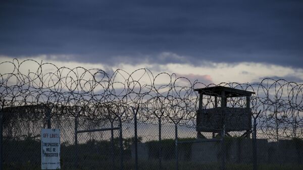 In this photo reviewed by U.S. military officials, the sun sets behind the closed Camp X-Ray detention facility, Wednesday, April 17, 2019, in Guantanamo Bay Naval Base, Cuba. - Sputnik International
