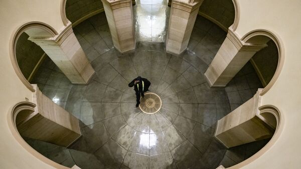 A U.S. Capitol Police officer walks through the U.S. Capitol Building on August 1, 2021 in Washington, DC. Congress is working to come to an agreement to pass President Biden's proposed infrastructure bill before they head into their August recess on the 9th.  - Sputnik International