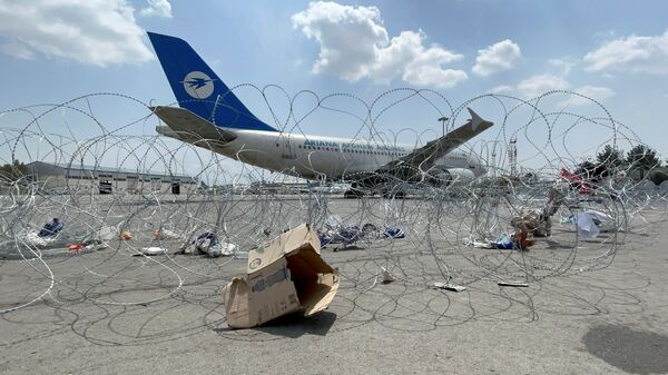 A commercial airplane is seen at the Hamid Karzai International Airport a day after U.S troops withdrawal in Kabul, Afghanistan August 31, 2021 - Sputnik International
