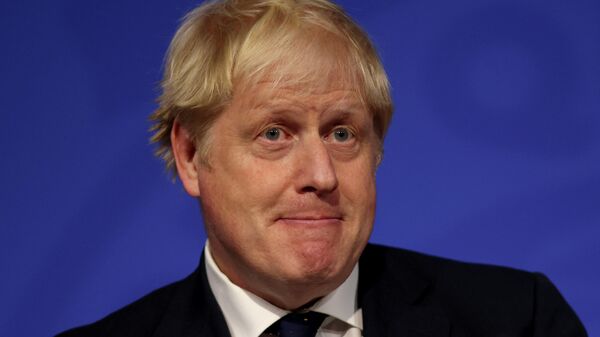 Britain's Prime Minister Boris Johnson holds a news conference in London - Sputnik International