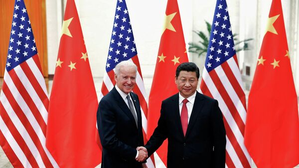 Chinese President Xi Jinping shakes hands with U.S. Vice President Joe Biden (L) inside the Great Hall of the People in Beijing December 4, 2013 - Sputnik International