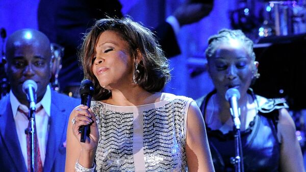 In this Feb. 13, 2011 file photo, singer Whitney Houston performs at the pre-Grammy gala & salute to industry icons with Clive Davis honoring David Geffen in Beverly Hills, Calif. - Sputnik International
