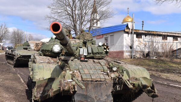DPR People's Militia in a tank ride along the street of the village of Bugas.
 - Sputnik International