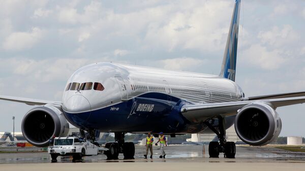  In this Friday, March 31, 2017, file photo, Boeing employees walk the new Boeing 787-10 Dreamliner down towards the delivery ramp area at the company's facility in South Carolina after conducting its first test flight at Charleston International Airport in North Charleston, S.C. Federal safety officials aren't ready to give back authority for approving new planes to Boeing when it comes to the large 787 jet, which Boeing calls the Dreamliner, Tuesday, Feb. 15, 2022. The plane has been plagued by production flaws for more than a year. - Sputnik International