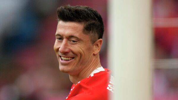 Bayern's Robert Lewandowski smiles during the German Bundesliga soccer match between Bayern Munich and Stuttgart, at the Allianz Arena, in Munich, Germany, Sunday, May 8, 2022 - Sputnik International