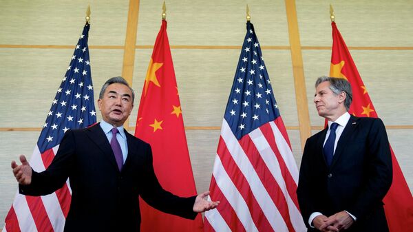 US Secretary of State Antony Blinken (R) and China's Foreign Minister Wang Yi attend a meeting in Nusa Dua on the Indonesian resort island of Bali on July 9, 2022. - Sputnik International
