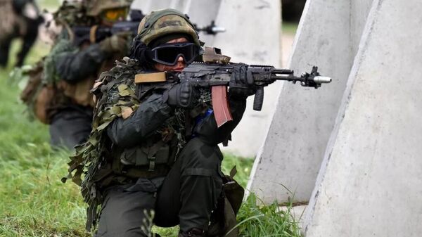 Soldiers during the Rapid Trident-2021 joint exercises of Ukraine and NATO countries at the Yavorovsky training ground in the Lvov Region. - Sputnik International