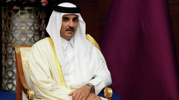 The Emir of Qatar, Sheikh Tamim bin Hamad Al Thani listens to Russian President Vladimir Putin during their meeting on the sidelines of the Conference on Interaction and Confidence Building Measures in Asia (CICA) summit, in Astana, Kazakhstan, Thursday, Oct. 13, 2022. - Sputnik International