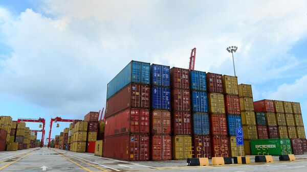 This photo taken on September 10, 2014 shows containers stacked up at the new Chinese-majority owned Colombo International Container Terminal (CICT) in Colombo. - Sputnik International