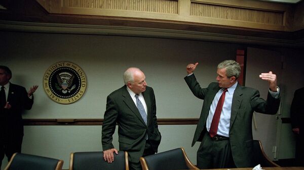 After returning to the White House from Air Force Base in Bellevue, Neb., President Bush talks with Vice President Dick Cheney in the Presidential Emergency Operations Center Sept. 11, 2001, in Washington. - Sputnik International