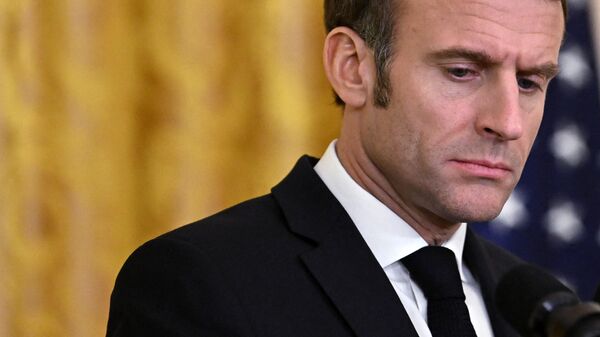 French President Emmanuel Macron listens to US President Joe Biden speak during a joint press conference on December 1, 2022.  - Sputnik International