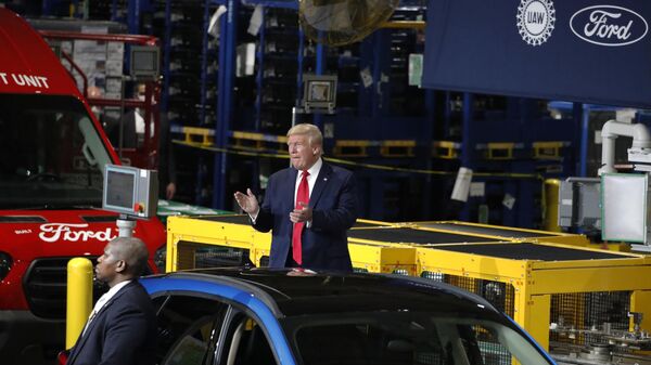 FILE - President Donald Trump claps as he walks to the podium to speak at Ford's Rawsonville Components Plant that has been converted to making personal protection and medical equipment, Thursday, May 21, 2020, in Ypsilanti, Mich. Former President Donald Trump will skip the second GOP presidential debate next week to travel to Detroit as the auto worker strike enters its second week. Trump is planning to speak with union members and will look to blunt criticisms from a United Auto Workers union leadership that has said a second Trump term would be a “disaster.” - Sputnik International