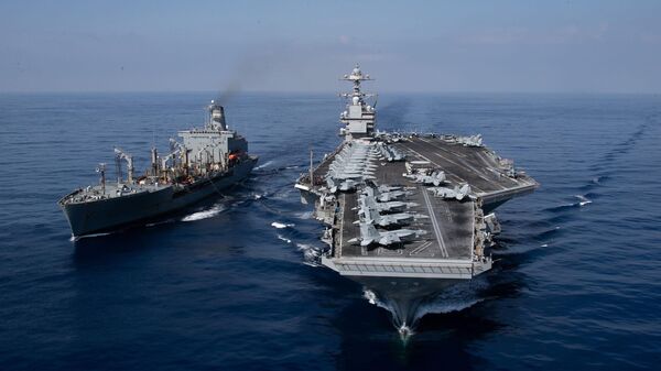 The world's largest aircraft carrier USS Gerald R. Ford (CVN) 78 and the USNS Laramie (T-AO-203) conduct a refueling-at-sea in the Eastern Mediterranean Sea, Oct. 11, 2023. - Sputnik International