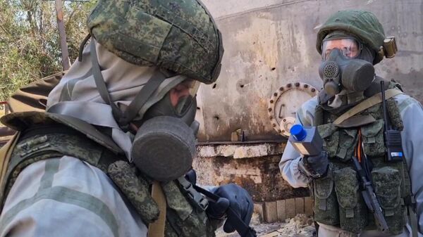 Russian Radiological, Chemical and Biological Defense Troops checking a chemical plant in the Donbass for signs of leakage after a Ukrainian shelling attack. File photo. - Sputnik International