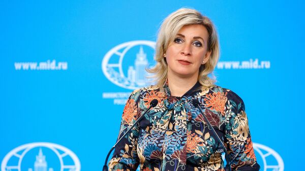 In this handout photo released by the Russian Foreign Ministry, Russian Foreign Ministry’s spokeswoman Maria Zakharova attends her weekly briefing in Moscow, Russia - Sputnik International