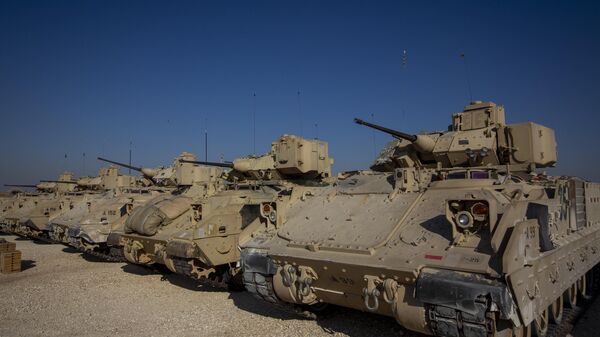 Bradley fighting vehicles are parked at a US military base at an undisclosed location in Northeastern Syria - Sputnik International