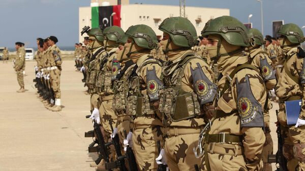 Libyan army cadets stand at attention for an audience including the prime minister, the commander of the Turkish training mission, and other dignitaries at their graduation ceremony of  in Tripoli, Libya, Tuesday, Feb. 8, 2022 - Sputnik International