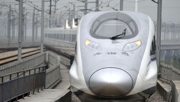 In this photo released by China's Xinhua news agency, a bullet train G80 leaves for Beijing from the Guangzhou South Railway Station in Guangzhou - Sputnik International