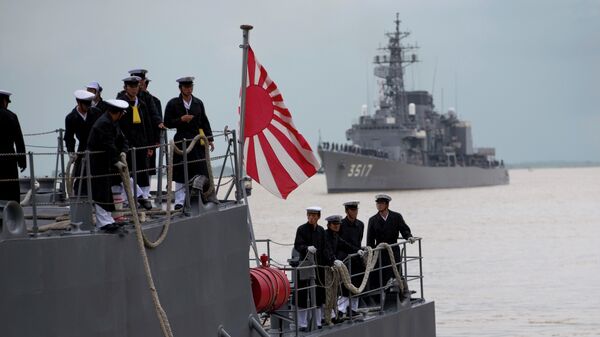 Japanese Navy officers stand on the deck of Japan Maritime Self-Defense Force's vessel docked at Thilawa port, Myanmar, Monday, Sept. 30, 2013 - Sputnik International