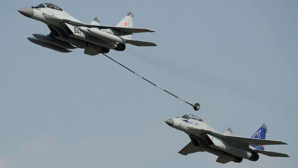 Russian multi-purpose jet fighters MiG-29, left, and MiG-35 perform a demonstration flight at the MAKS-2011 international air show in Zhukovsky near Moscow - Sputnik International