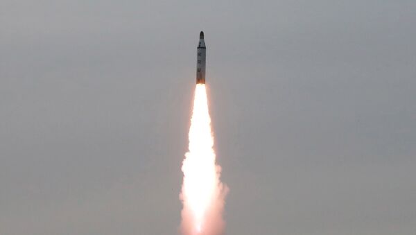 North Korean leader Kim Jong Un guides on the spot the underwater test-fire of strategic submarine ballistic missile in this undated photo released by North Korea's Korean Central News Agency (KCNA) in Pyongyang on April 24, 2016 - Sputnik International