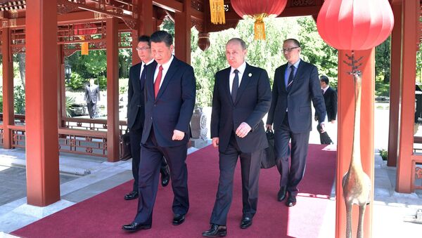 May 14, 2017. President Vladimir Putin and President of China Xi Jinping, right, during a walk after the Russia-China talks at the One Belt, One Road international forum. - Sputnik International