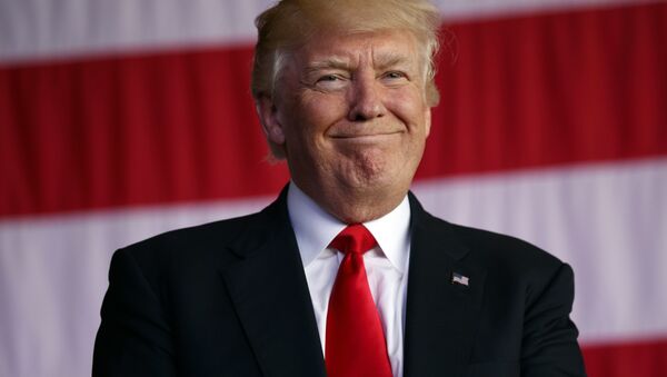 Trump smiles as he is introduced to speak to U.S. military troops and their families at Naval Air Station Sigonella, Saturday, May 27, 2017, in Sigonella, Italy. - Sputnik International
