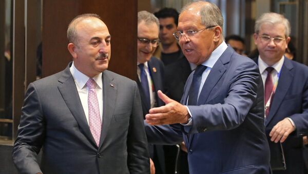 From right: Russian Foreign Minister Sergei Lavrov meets Turkish Foreign Minister Mevlut Cavusoglu. - Sputnik International