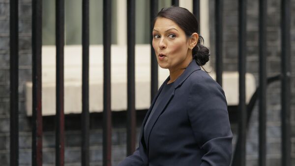 Britain's then-secretary of state for international development Priti Patel reacts to a question from the media as she arrives for a cabinet meeting at 10 Downing Street in London, 10 October 2017.  - Sputnik International