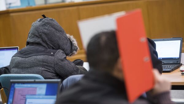 (File) In this Nov. 9, 2016 file photo defendants wait for the start of the hearing in the district court in Wuppertal, Germany. A German federal court on Thursday Jan. 11, 2018 overturned the acquittal of seven men who posed as a self-styled “Sharia police,” ordering a retrial on charges that they violated rules on wearing uniforms. - Sputnik International