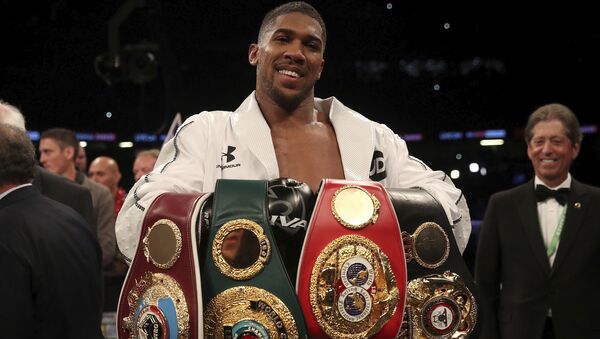 Anthony Joshua holds the WBA, IBF and WBO belts after beating Joseph Parker in Cardiff - Sputnik International