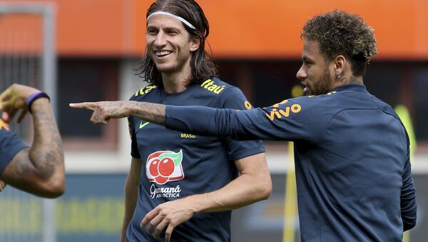 Brazil's Filipe Luis and Neymar, from left, jokes during a national soccer squad training session at the Ernst Happel Stadium in Vienna, Austria, Sturday, June 9, 2018. - Sputnik International