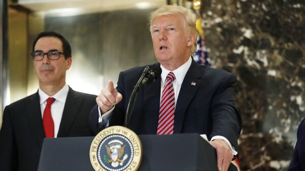 President Donald Trump, accompanied by Treasury Secretary Steven Mnuchin, speaks to the media in the lobby of Trump Tower in New York, Tuesday, Aug. 15, 2017 - Sputnik International