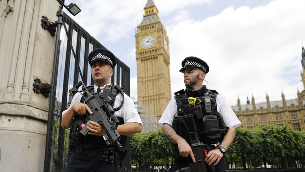 Armed police patrol by the Houses of Parliament on June 16, 2017. - Sputnik International