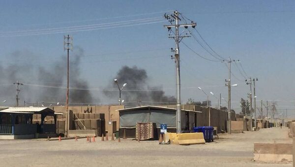 The US Army soldier that provided the photo to Fox News says that the pits are about 400 yards from their barracks and that the smoke often hangs over their section of the base. Camp Taji, Iraq, July 11, 2018. - Sputnik International