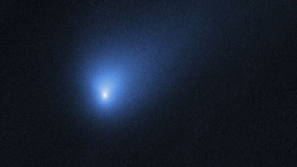 This 12 October 2019 photo made available by NASA shows the comet 2I/Borisov, seen by the Hubble Space Telescope. It’s the second known interstellar visitor to swoop through our backyard. An amateur astronomer from Crimea, Gennady Borisov, discovered the comet in August, two years after the first alien guest, a cigar-shaped rock, popped up - Sputnik International