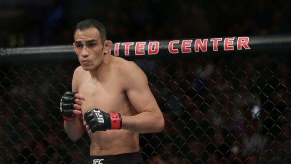FILE PHOTO: Jun 8, 2019; Chicago, IL, USA; Tony Ferguson (red gloves) before fighting Donald Cerrone (blue gloves) during UFC 238 at United Center. - Sputnik International