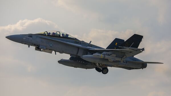 A F/A-18D Hornet with Marine All Weather Fighter Attack Squadron 242 loaded with AGM-84D Harpoon missiles takes off from Marine Corps Air Station (MCAS) Iwakuni Japan, April 28, 2020. - Sputnik International